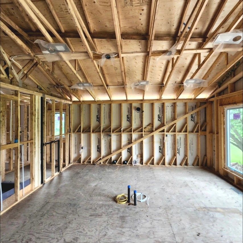 Framed great room with pot light housings and wiring roughed in